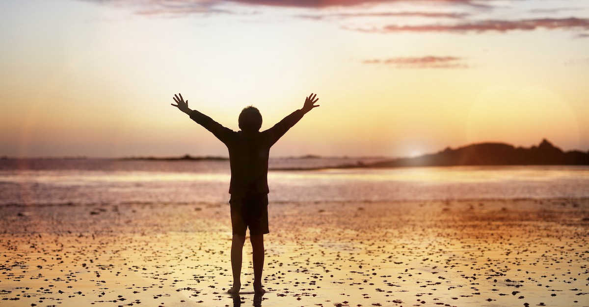 person on beach near sunset, poor in spirit